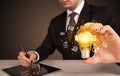 Businessman holding a light bulb, social media concept