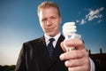 Businessman holding lightbulb Royalty Free Stock Photo
