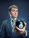 Businessman holding magic ball in his hand Royalty Free Stock Photo