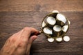 Businessman Holding Magnifying Glass Over Coins Royalty Free Stock Photo