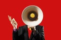 Businessman Holding Megaphone against red background Royalty Free Stock Photo