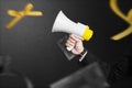 Businessman holding megaphone to announce of Black Friday promotion Royalty Free Stock Photo