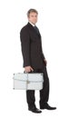 Businessman holding metal suitcase Royalty Free Stock Photo