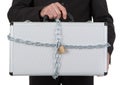 Businessman holding metal suitcase