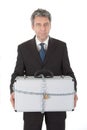 Businessman holding metal suitcase Royalty Free Stock Photo