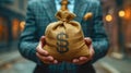Businessman holding a money bag in his hands Royalty Free Stock Photo