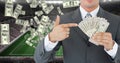 Businessman holding money at football stadium representing corruption Royalty Free Stock Photo