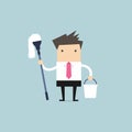 Businessman holding mop and bucket. Cleaning the workplace concept.