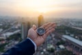 Businessman holding a navigation compass in hand and define marketing direction, Abstract business Royalty Free Stock Photo