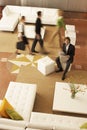 Businessman Holding Newspaper With Coworkers Walking In Office Lobby Royalty Free Stock Photo