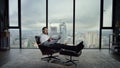 Businessman holding open newspaper in office. Worker reading financial newspaper Royalty Free Stock Photo