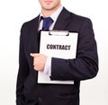 Businessman holding out a contract Royalty Free Stock Photo