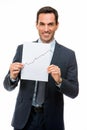 Businessman holding paper with growing chart