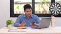 Businessman Holding Pen and Smartphone for Calling Marketing Consulting Analyst with Partner With the calculator, laptop, computer