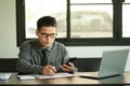 Businessman Holding Pen and Smartphone for Calling Marketing Consulting Analyst with Partner With the calculator, laptop, computer