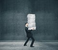 Businessman holding pile documents