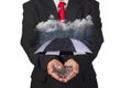 Businessman Holding A Protective Umbrella Over A Financial Investment During Stormy Days