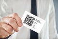 Businessman holding QR code business card