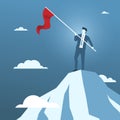 Businessman Holding Red Flag on the Top of Mountain. Royalty Free Stock Photo