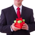 Businessman holding red gift box Royalty Free Stock Photo
