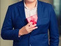 Businessman holding the red gift box Royalty Free Stock Photo