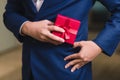 Businessman holding the red gift box Royalty Free Stock Photo