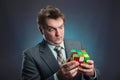 Businessman holding rubik cube in his hands Royalty Free Stock Photo