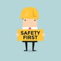 Businessman holding safety first sign Royalty Free Stock Photo