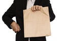 Businessman holding(Sharing,giving) brown paper bag lunch, isolated on white background Royalty Free Stock Photo