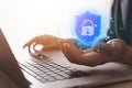 Businessman holding a shield icon with a lock mark. computer data password protection concept internet network security Cyber