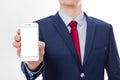 Businessman holding and showing blank screen cell phone isolated on white background. Copy space and selective focus Royalty Free Stock Photo