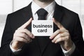 Businessman holding sign business card