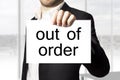 Businessman holding sign out of order burnout
