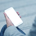 Businessman holding smart phone with empty screen