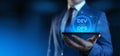 Businessman holding smartphone with Dev Ops Development Operations icons on screen Royalty Free Stock Photo