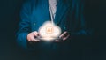 Businessman holding smartphone with glowing AI cloud computing icon, Concept for artificial intelligence, big data processing, Royalty Free Stock Photo