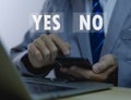 Businessman holding smartphones showing yes or no The concept of a voting decision. Agree. Think about right or wrong business Royalty Free Stock Photo