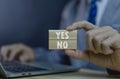 Businessman holding smartphones showing yes or no The concept of a voting decision. Agree. Think about right or wrong business Royalty Free Stock Photo