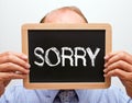 Businessman holding sorry sign Royalty Free Stock Photo