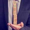 Businessman holding a stack of checked boxes Royalty Free Stock Photo