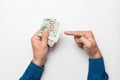 businessman holding a stack of euro banknotes in his hand, points his finger at money, income, success Royalty Free Stock Photo