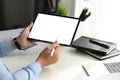 Businessman holding stylus pen pointing on screen of tablet computer. Royalty Free Stock Photo