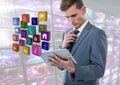 Businessman holding tablet with apps with colorful screens visuals Royalty Free Stock Photo