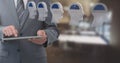 Businessman holding tablet with brain maze heads in office