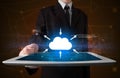 Businessman holding tablet with cloud icon Royalty Free Stock Photo