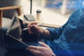 Businessman holding tablet on hand and using electronic pen while working at office.Pointing tablet screen.Blurred Royalty Free Stock Photo