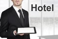 Businessman holding tablet hotel