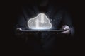 Businessman holding tablet with virtual cloud computing icon for sharing upload download data information and technology Royalty Free Stock Photo