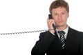 Businessman holding a telephone handset Royalty Free Stock Photo