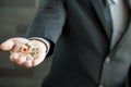 Businessman holding three dices